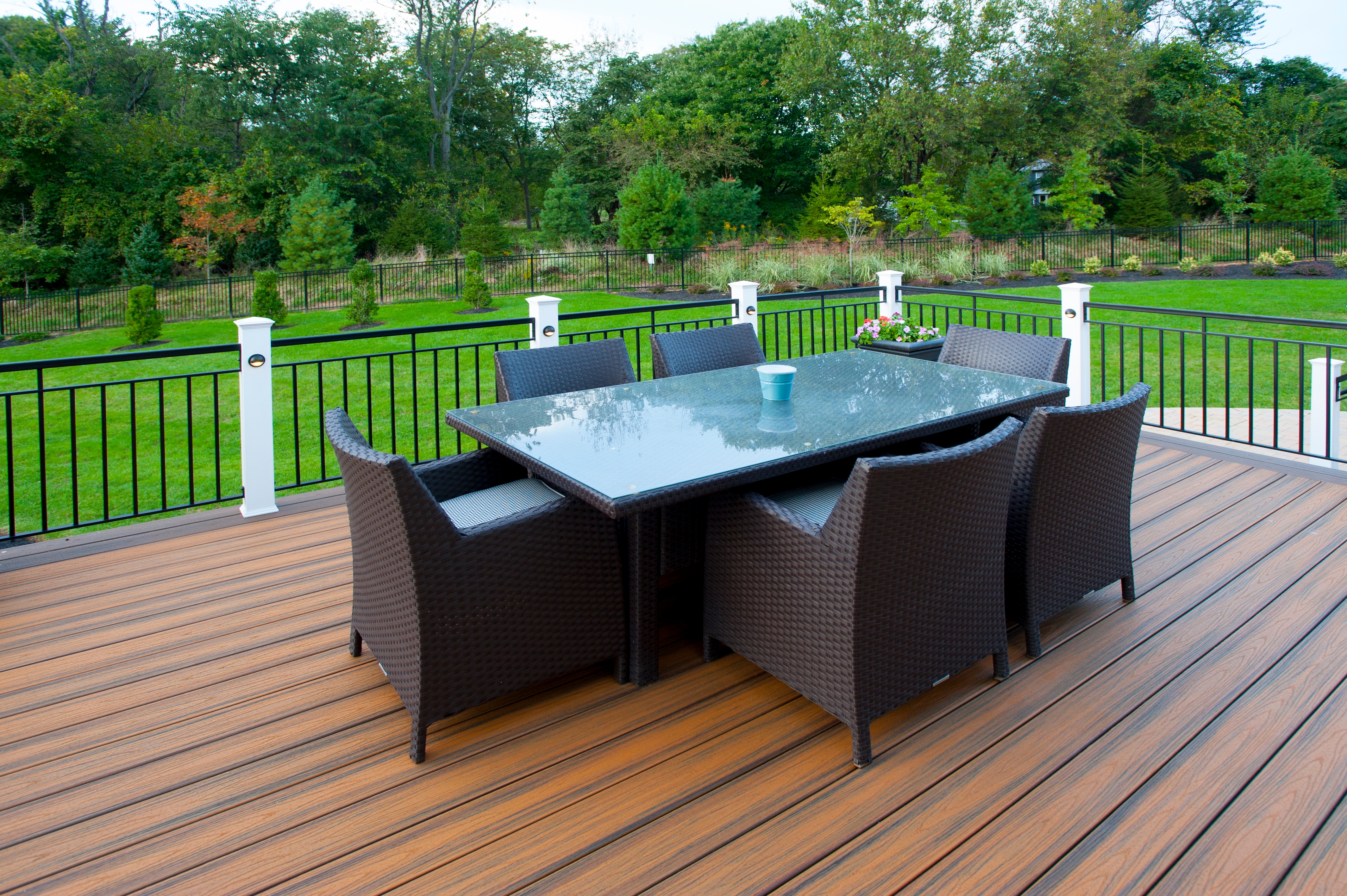 Custom Outdoor Kitchen With Copper Roof And Low Maintenance Deck