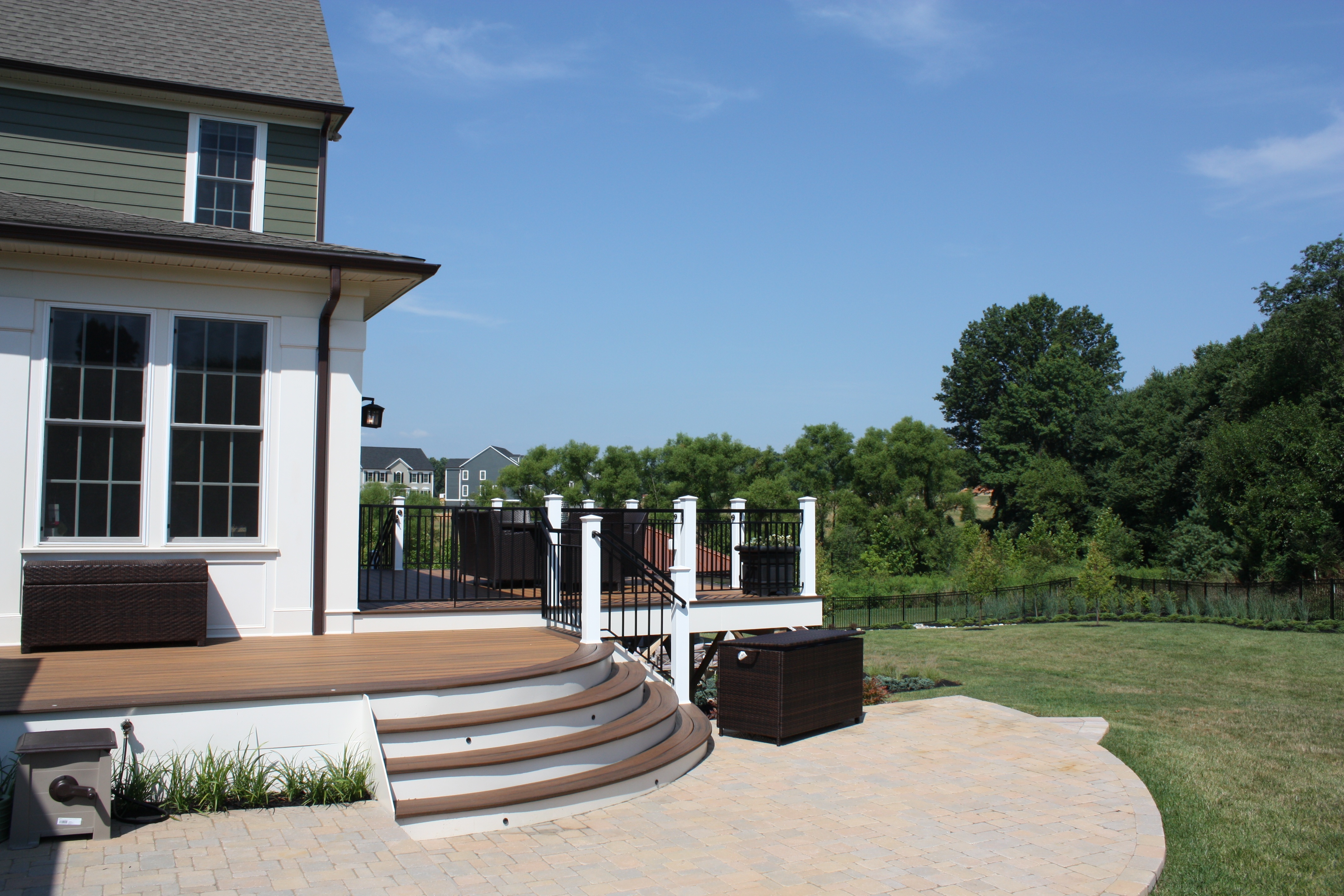 Custom Outdoor Kitchen With Copper Roof And Low Maintenance Deck