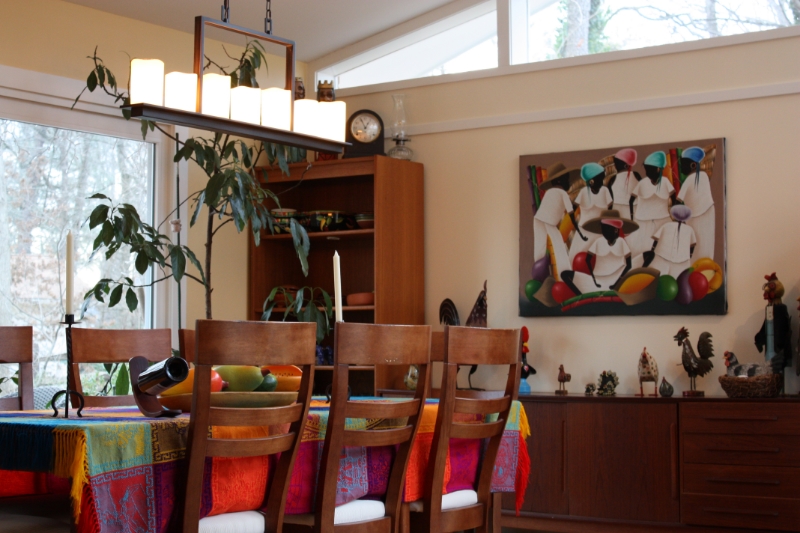 new dining room expansion with stained wood furniture and a colorful tabletop display