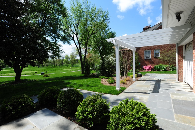 elevated flagstone patio with white trim in Rockville, Maryland