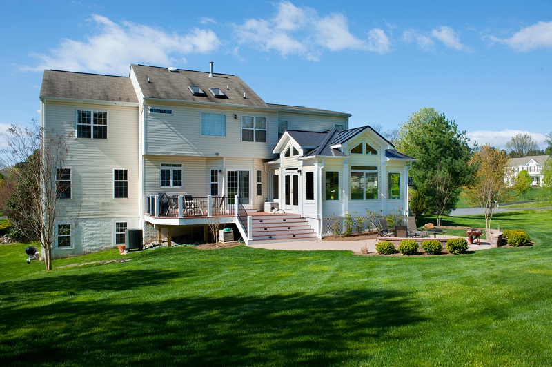 Belgard Patio, Azek Deck, and Sun Room Addition Built in Damascus, Maryland by Design Builders, Inc.