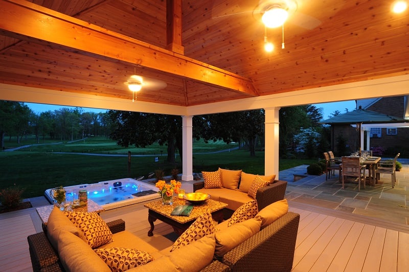 AZEK deck with hot tub lit up at night in Rockville, Maryland