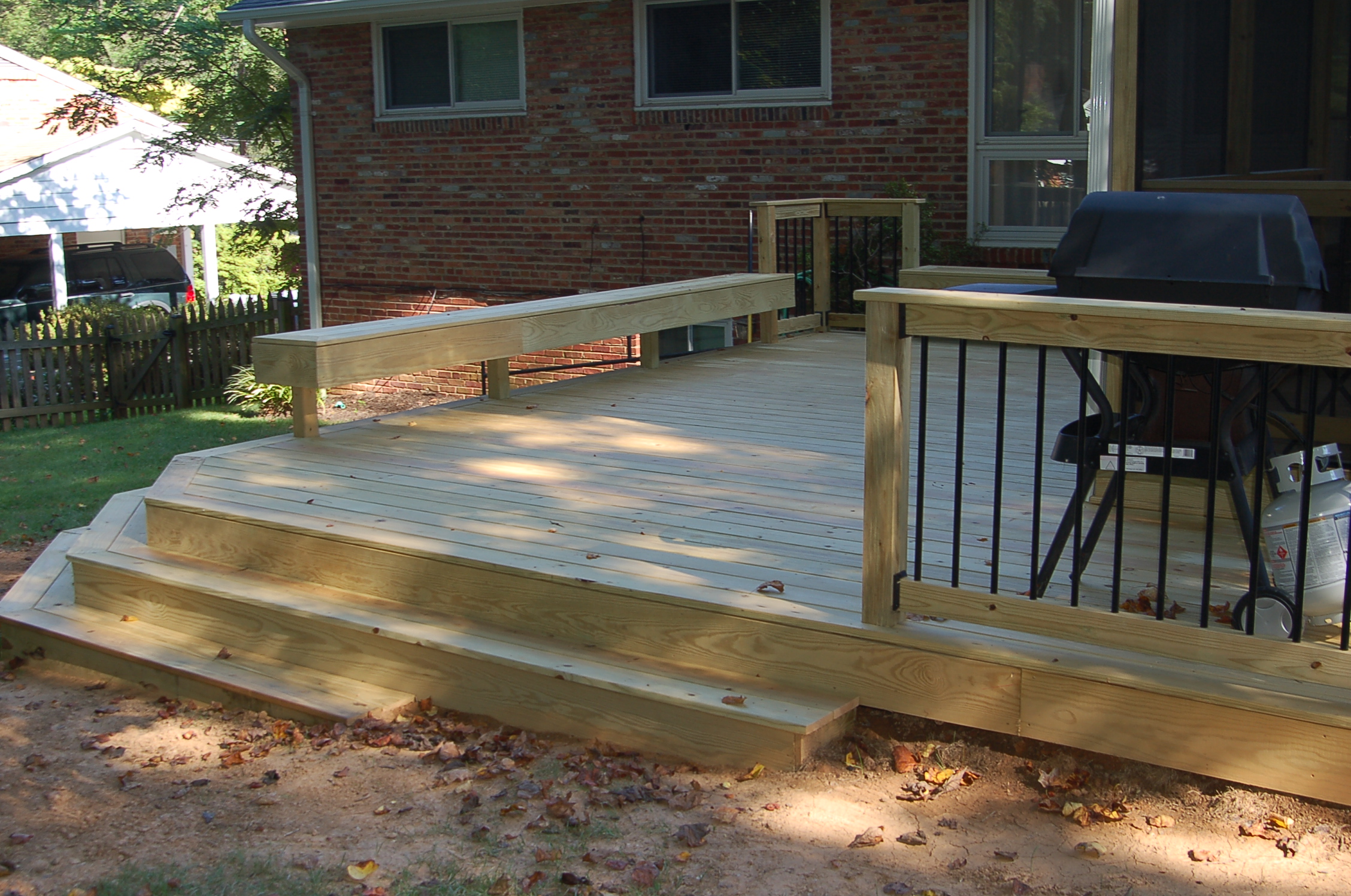 unstained pressure-treated screened room and deck in Bethesda