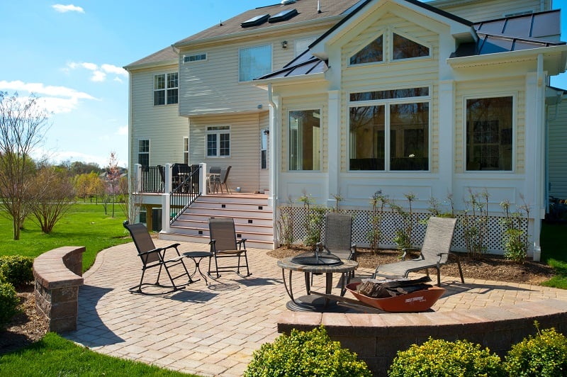 Belgard Patio, Azek Deck, and Sun Room Addition Built in Damascus, Maryland by Design Builders, Inc.