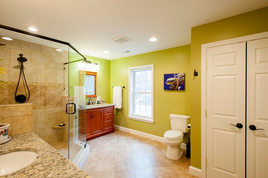 designer master bathroom in green divided sinks custom shower Fairfax VA