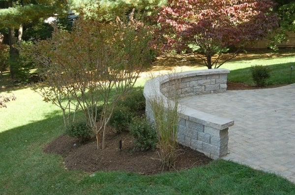 curved sitting wall builder in Potomac, MD with paver patio far shot
