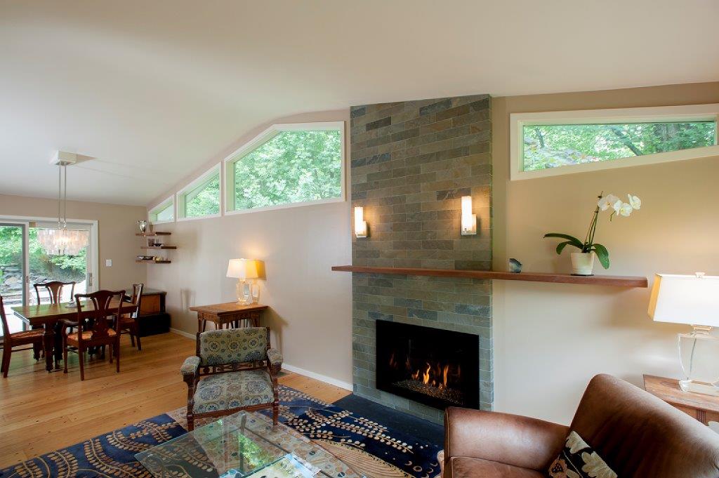 stone fireplace living room and dining interior remodeling project in Bethesda, Maryland