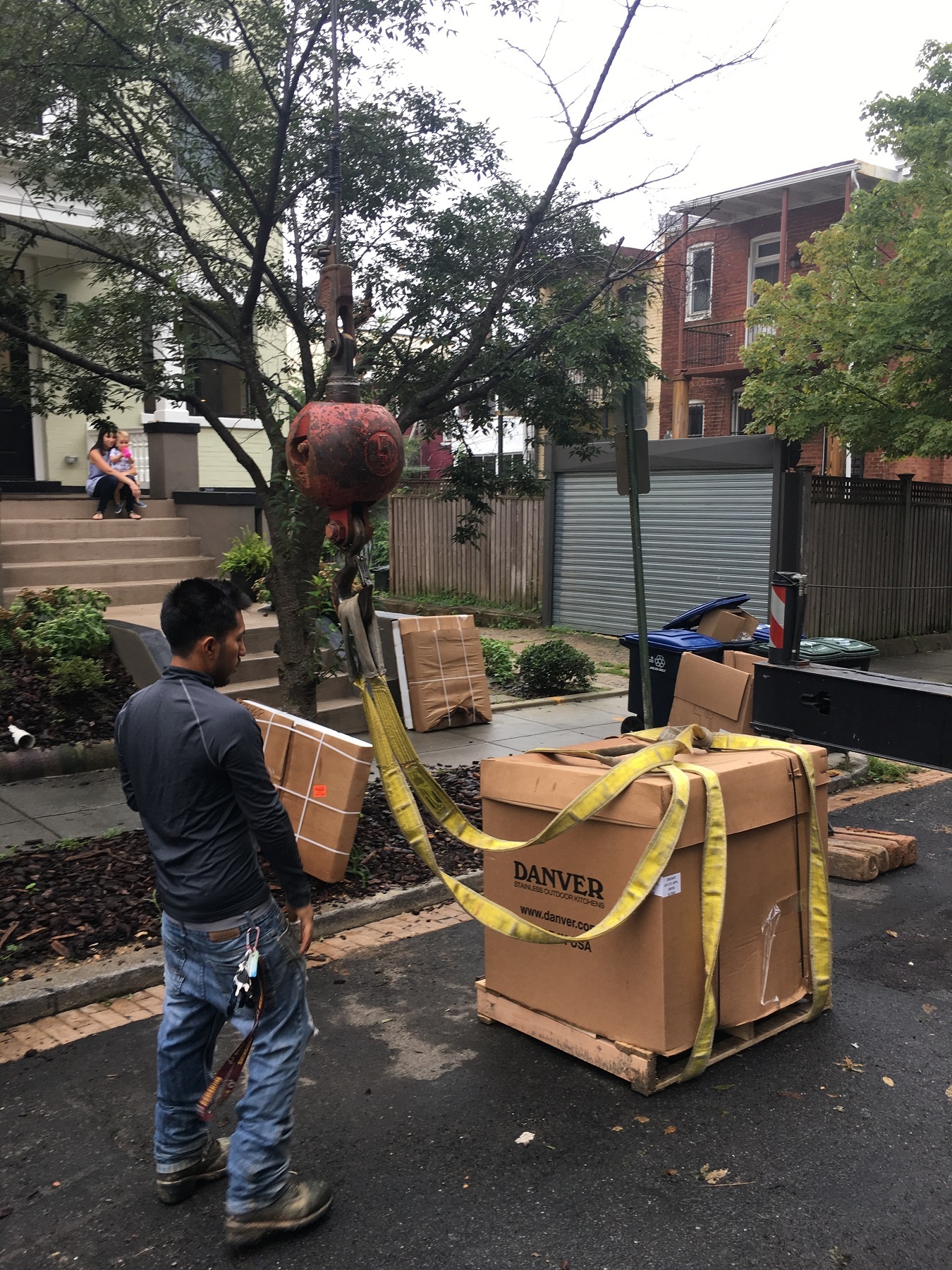 loading a crane with danver cabinets for a rooftop deck delivery in Washington, DC