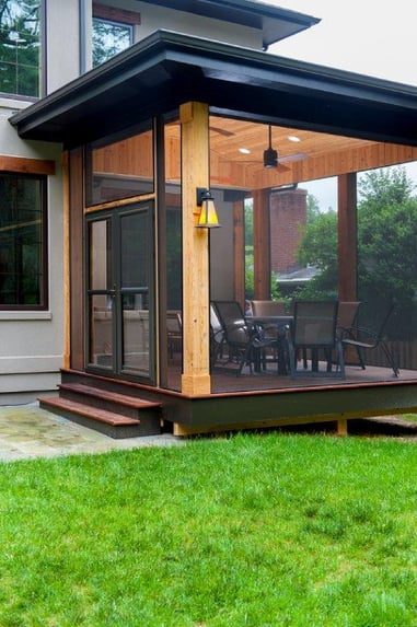 hardwood screened-in porch of contemporary design with black trim