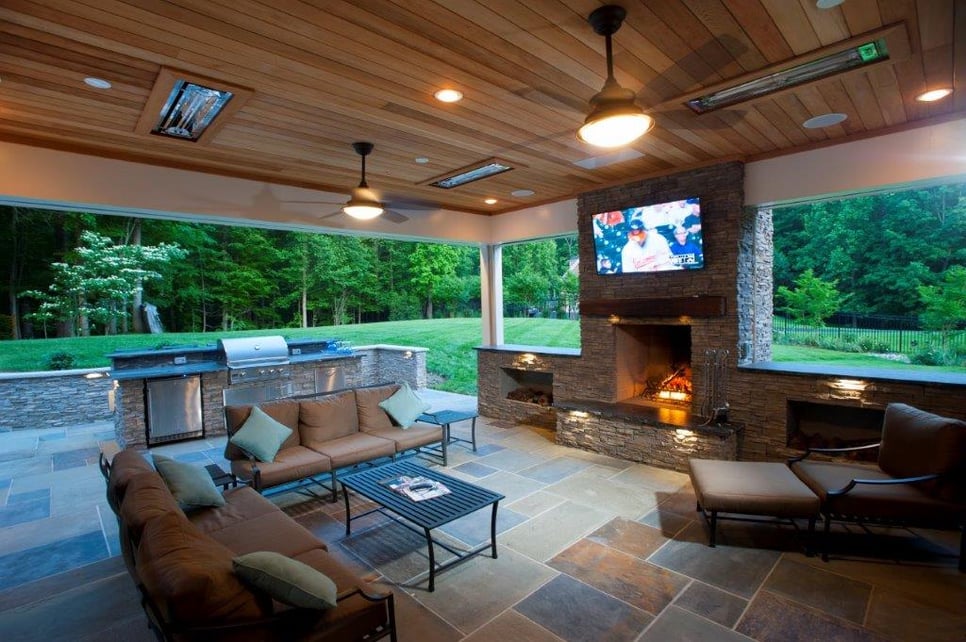 burning stone fireplace in a screened porch backyard clifton virginia