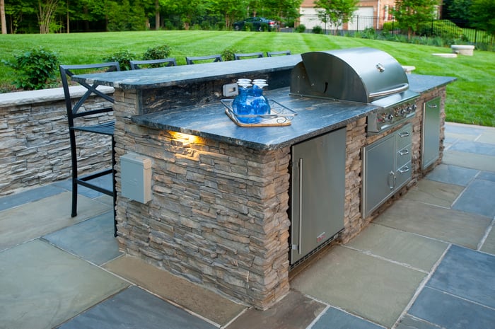Eldorado_stone_outdoor_kitchen_with_Blaze_grill_trash_pull_outdoor_fridge_and_stainless_steel_outdoor_kitchen_cabinet_inserts_3