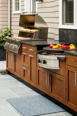 outdoor kitchen grill with Danver stainless outdoor cabinets. Image courtesy of Danver Cabinets.