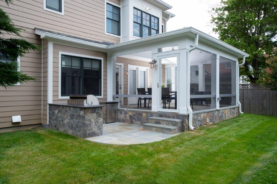 elevated flagstone screen room with outdoor kitchen patio in bethesda