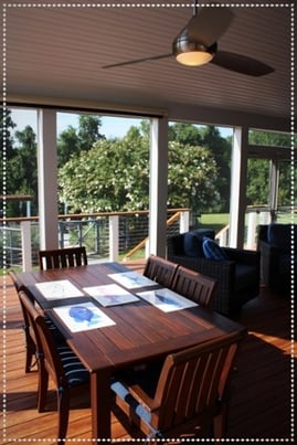 minka-aire ceiling fan in a white screened porch with zuri decking