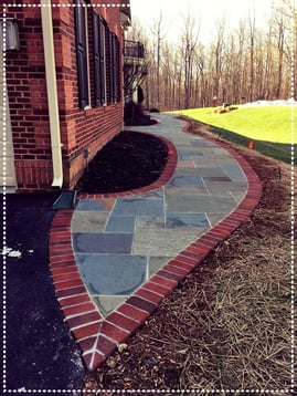 flagstone patio with decorative brick border in Clifton, Virginia