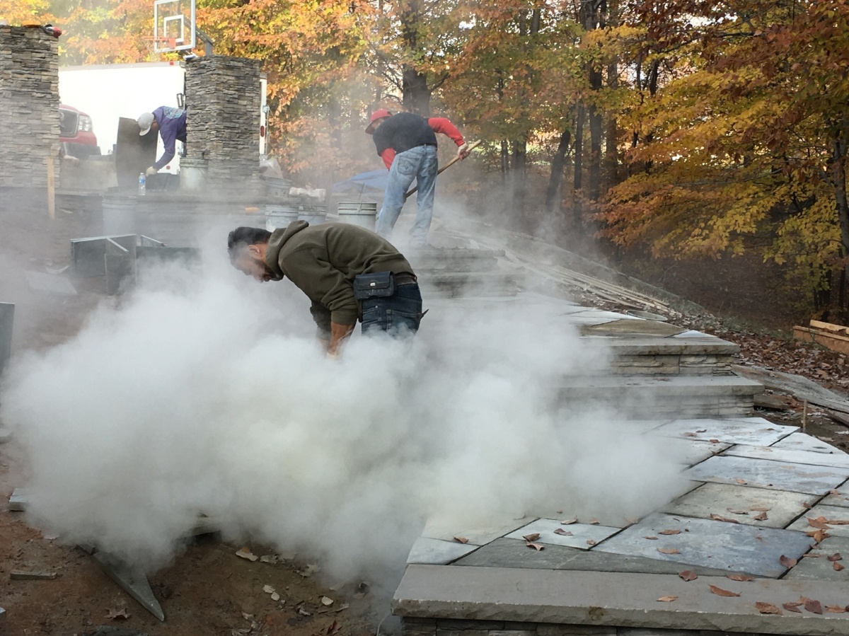 concrete patio stones being cut for a patio installation in Clifton, Virginia