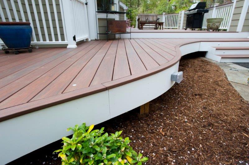 curved low-maintenance deck made with Wolf rosewood deck boards