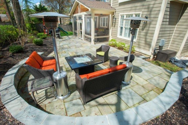 custom curved sitting wall and flagstone patio